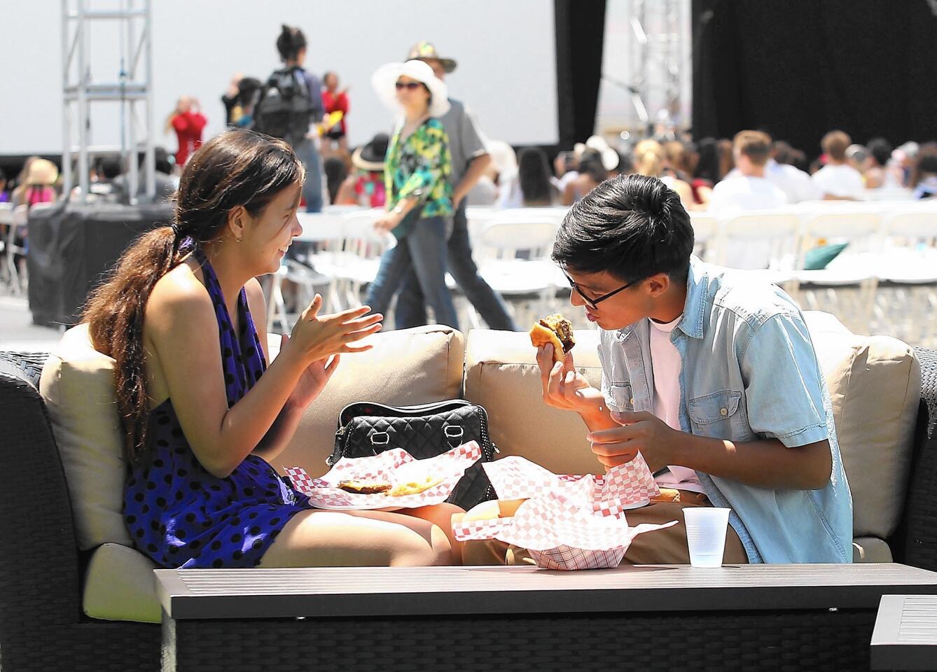 A couple enjoy the lounge seats at the new Sliders at the 2015 Orange County Fair.