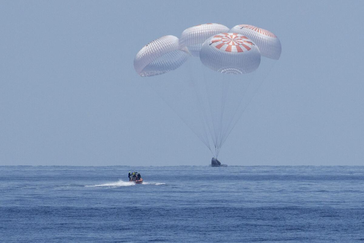 SpaceX's Crew Dragon capsule lands in the Gulf of Mexico.