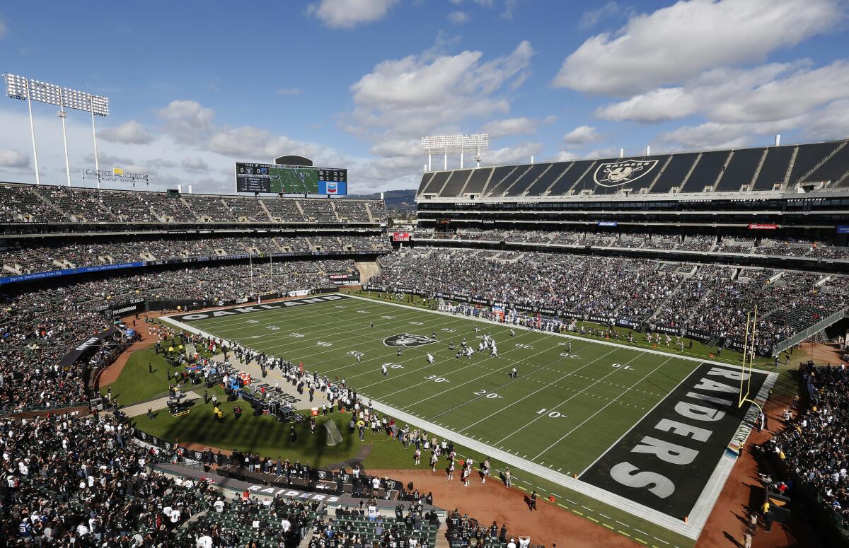Fans watch from a general view at Oakland Alameda County Coliseum during the first half of an NFL football game between the Oakland Raiders and the Indianapolis Colts in Oakland, Calif., Sunday, Oct. 28, 2018.