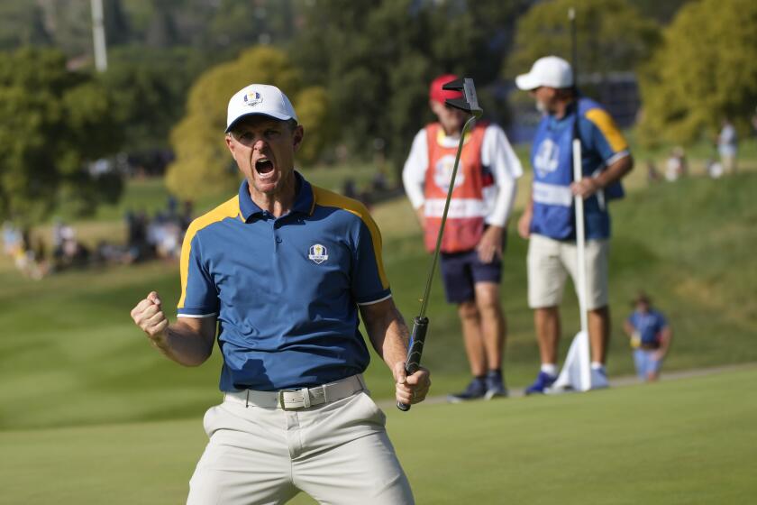 Europe's Justin Rose celebrates on the 15th green during his singles match at the Ryder Cup golf tournament at the Marco Simone Golf Club in Guidonia Montecelio, Italy, Sunday, Oct. 1, 2023. (AP Photo/Alessandra Tarantino)