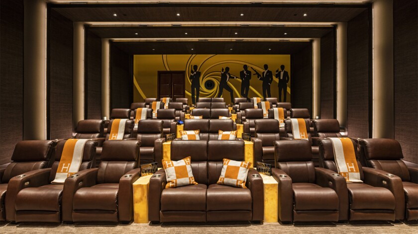 Automated recliners fillered lines in the 4K movie theater.