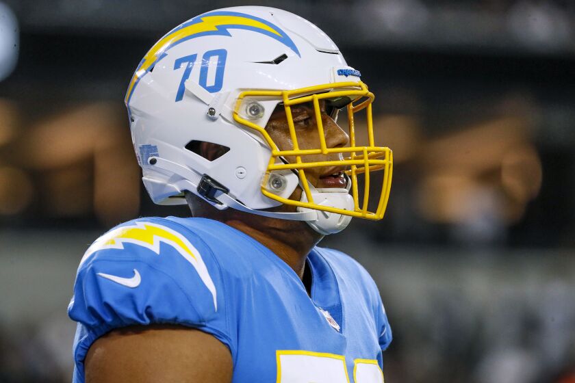Inglewood CA, Monday, October 4, 2021 - Los Angeles Chargers offensive tackle Rashawn Slater (70) during a break in the action against the Las Vegas Raiders at SoFi Stadium. (Robert Gauthier/Los Angeles Times)