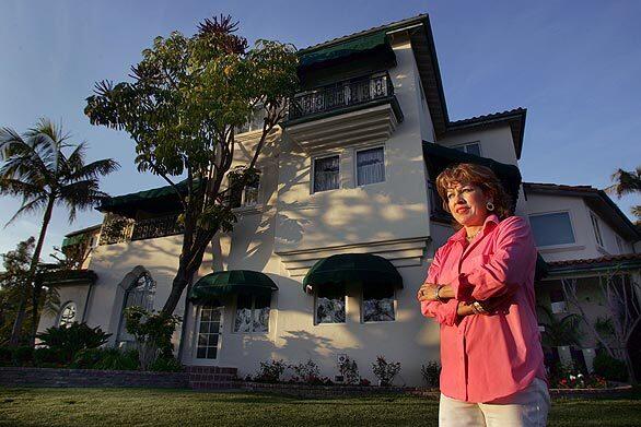 Rebecca Zapanta is shown in front of her Mediterranean mansion that sits on a hill in Whittier. Zapanta and her husband are among a wave of professionals who are reshaping the city into a destination spot for upper middle class and upper class Latino life in Southern California.