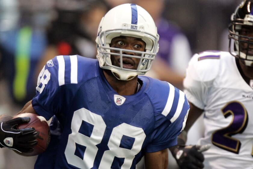 Colts receiver Marvin Harrison races toward the end zone during a game against the Baltimore Ravens' in Indianapolis on Oct. 12, 2008.
