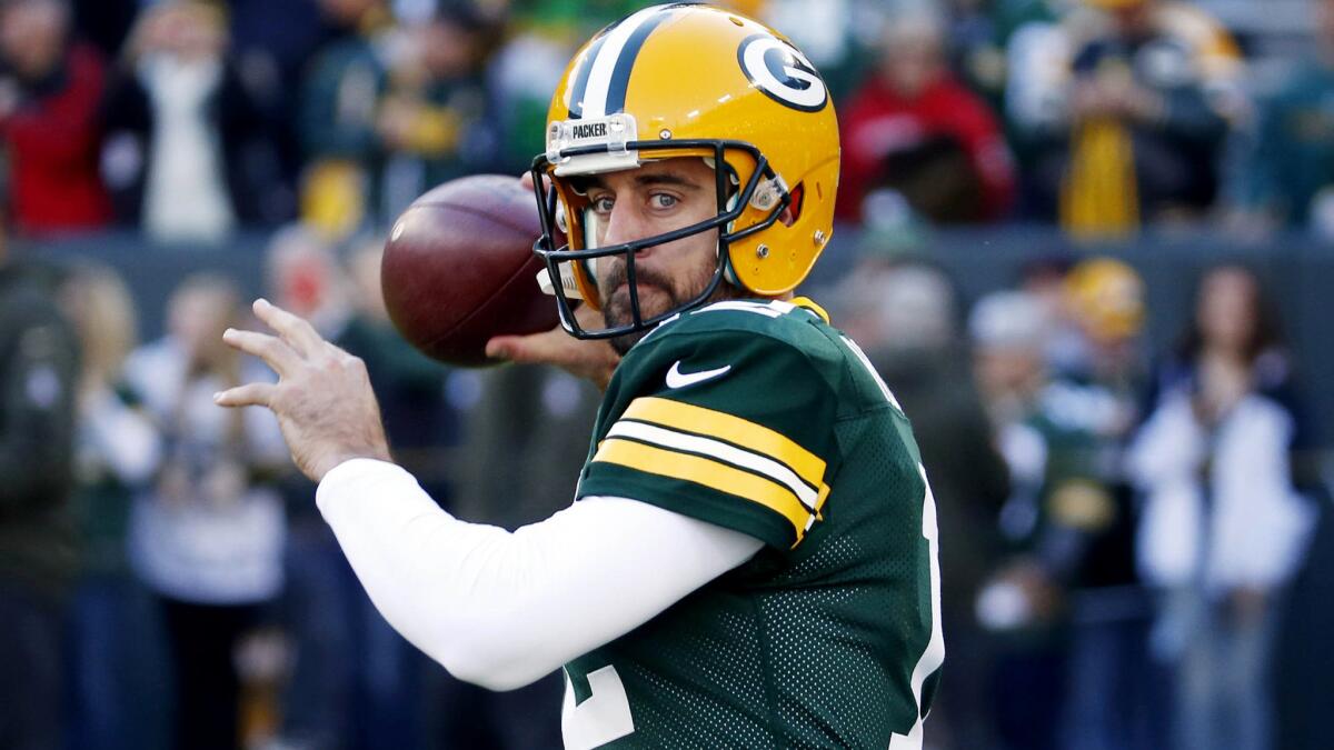 Quarterback Aaron Rodgers warms up before the Packers' game against the Lions on Nov. 15.