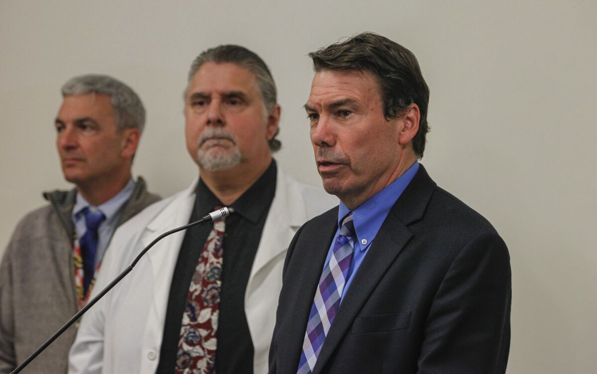 Dr. Christopher Braden, (right), director of San Diego quarantine efforts for the U.S. Centers for Disease Control and Prevention, updates the press on Tuesday, Feb. 11 in San Diego. Braden appeared with doctors Eric McDonald (left) and Nick Yphantides.