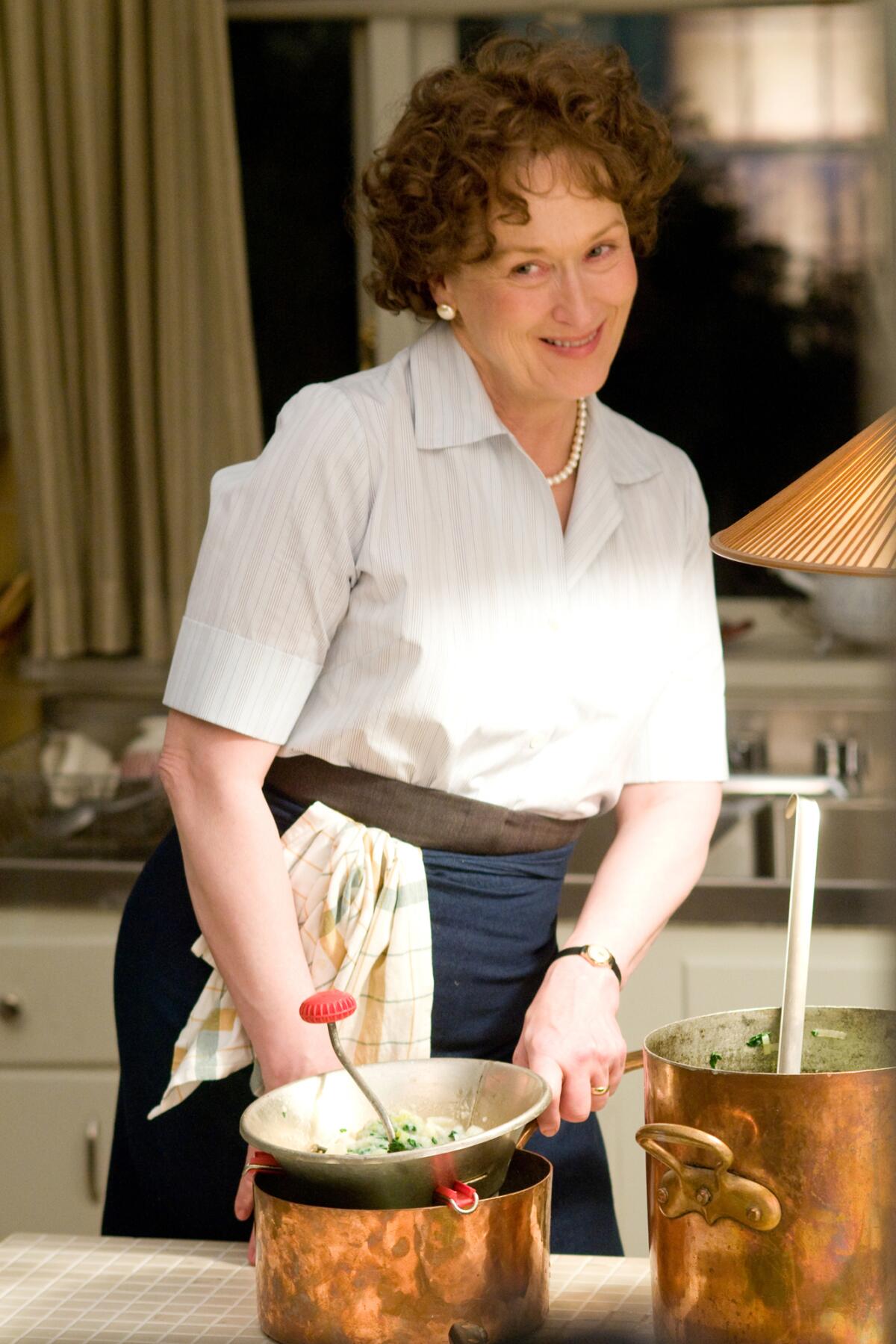 Meryl Streep as Julia Child, preparing food in the movie “Julie & Julia” (2009)