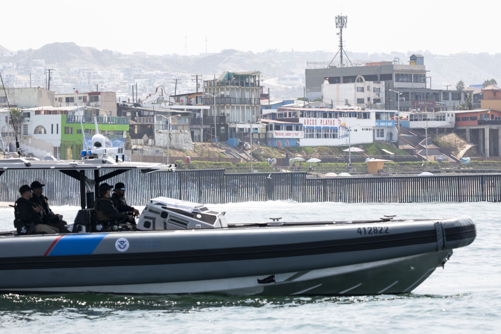 Marine interdiction agents patrol in a boat off the coast.