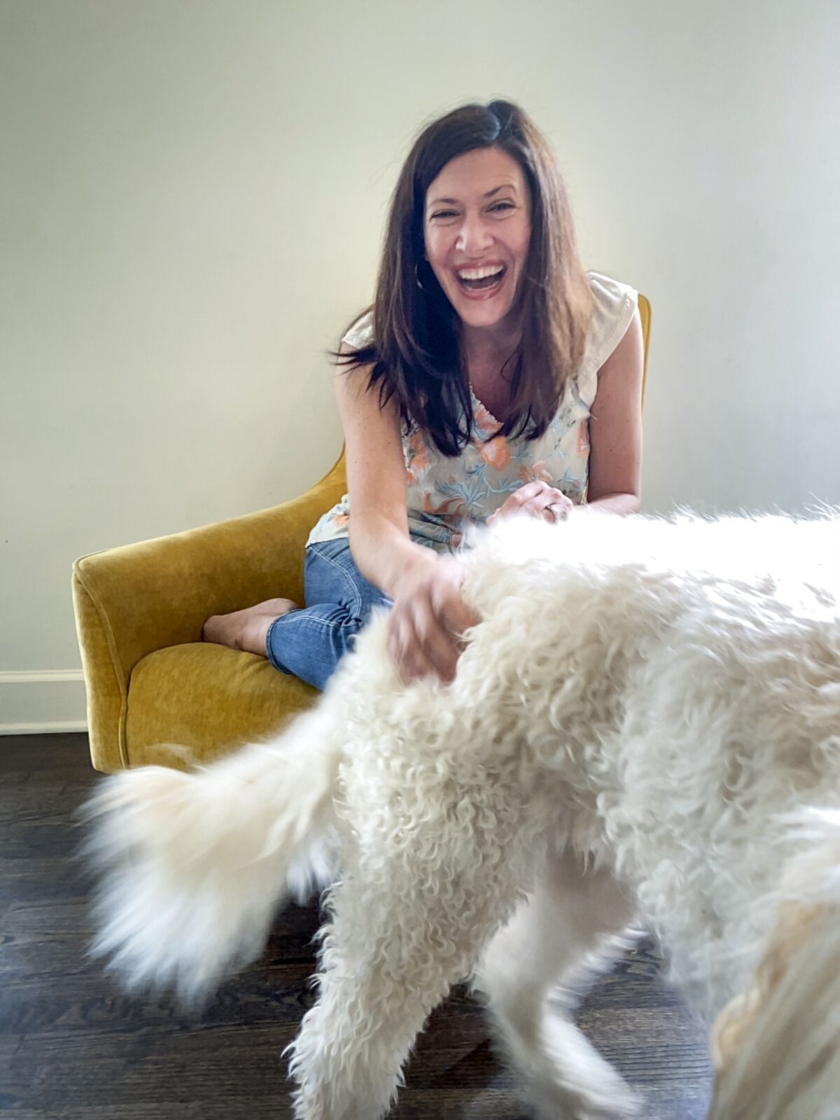"Real World" star Julie Gentry petting her dog Martha. 