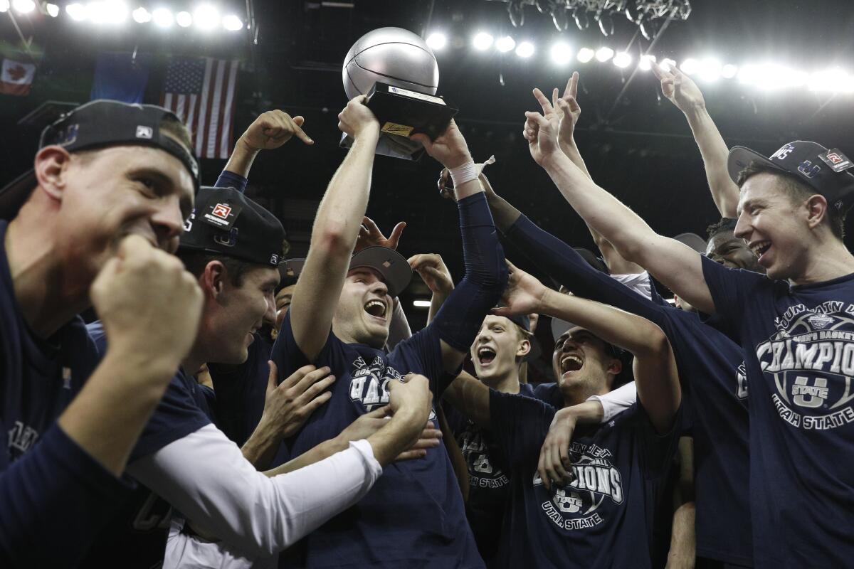 Utah State's Sam Merrill is named tournament MVP after the Aggies beat San Diego State 59-56 in the Mountain West title game.