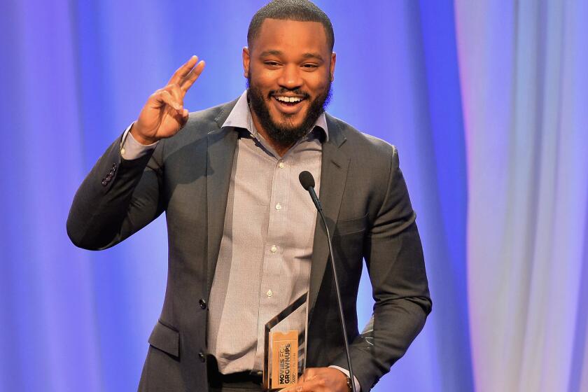 "Creed" director Ryan Coogler accepts the award for best intergenerational movie at AARP's 15th annual Movies for Grownups Awards in Beverly Hills on Monday.