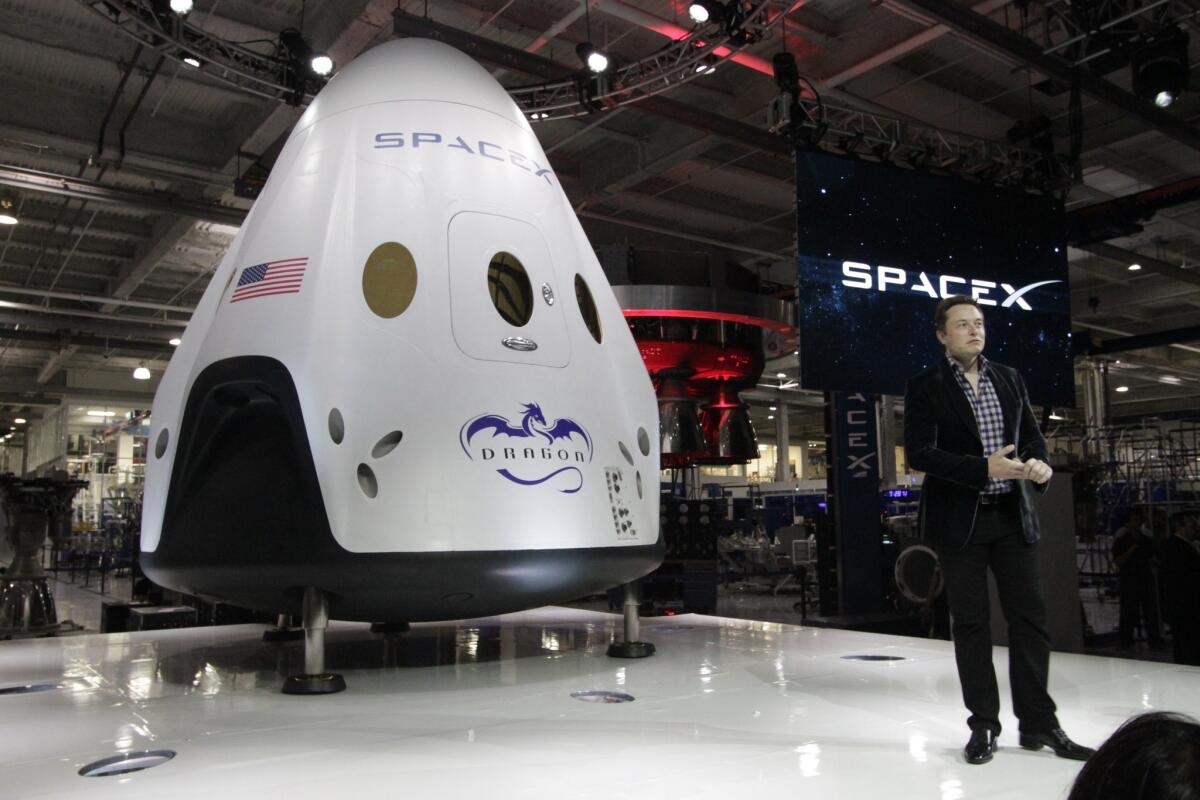 SpaceX CEO Elon Musk introduces the Dragon 2 spacecraft at SpaceX facilities in Hawthorne.