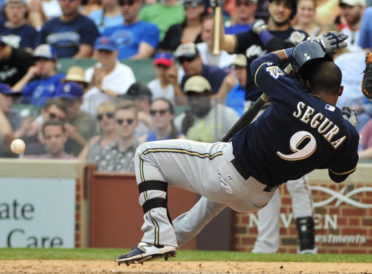 Brewers shortstop Jean Segura reacts after getting hit by a pitch against the Cubs in the eighth inning.