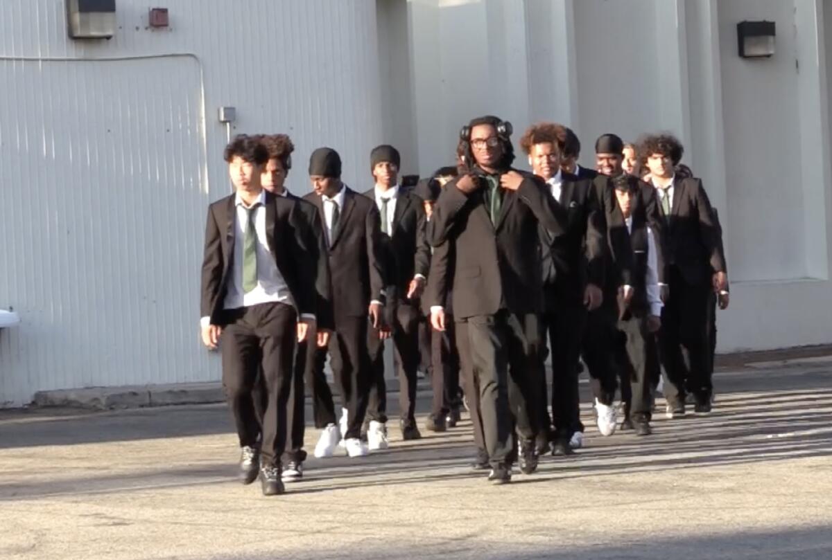 It's suit and tie for Hamilton players as they arrive for game against Crenshaw at Fairfax.