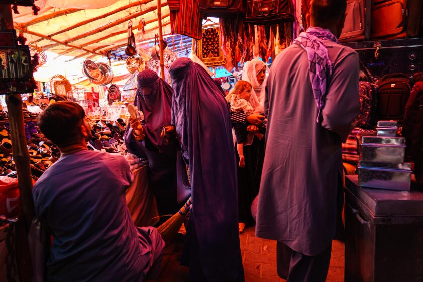 KABUL, AFGHANISTAN -- AUGUST 22, 2021: Women shop in the womenOs area of the Lycee Maryam Bazaar in the Khair Khana neighborhood in Kabul, Afghanistan, Sunday, Aug. 22, 2021. (MARCUS YAM / LOS ANGELES TIMES)