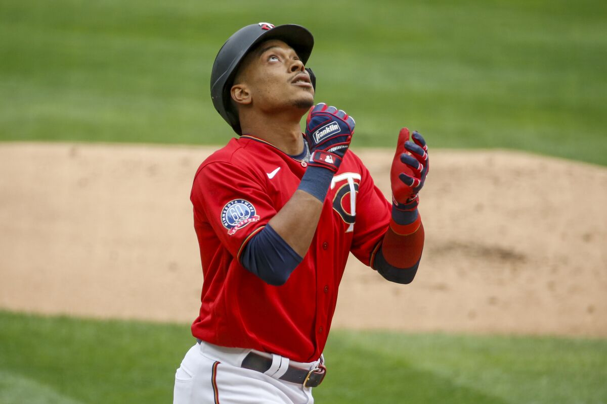 Minnesota Twins' Jorge Polanco celebrates his solo home run against the Detroit Tigers in the first inning of the first game of a baseball doubleheader Friday, Sept. 4, 2020, in Minneapolis. (AP Photo/Bruce Kluckhohn)