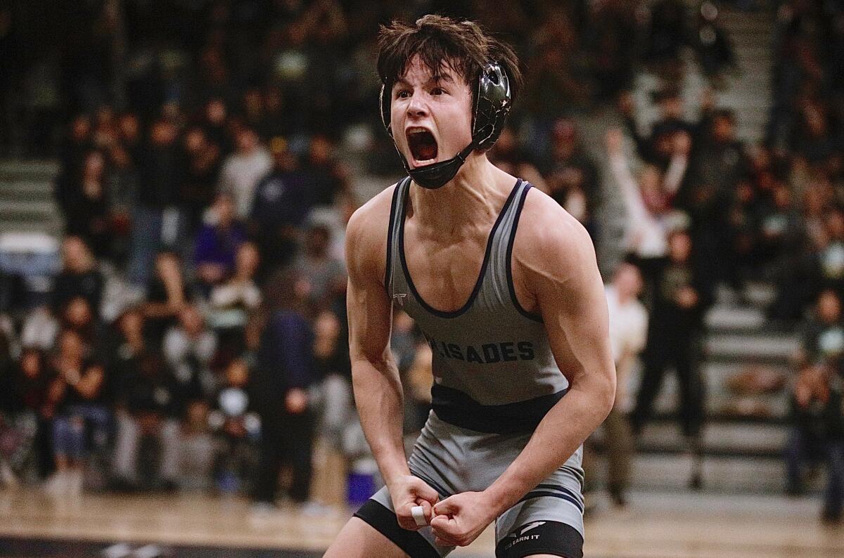 Palisades’ James Van Wagenen celebrates after winning the 126-pound City Section title in dramatic fashion on Feb. 10, 2024.