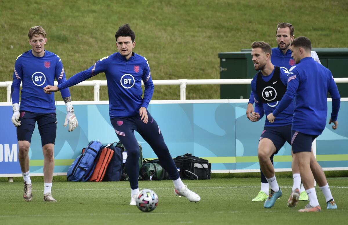 England's goalkeeper Jordan Pickford, Harry Maguire, Jordan Henderson, Harry Kane and Kieran Trippier during a training session at St George's Park, Burton upon Trent, England, Monday July 5, 2021, ahead of their Euro 2020 soccer championship semifinal match against Denmark in London on Wednesday. (AP Photo/Rui Vieira)