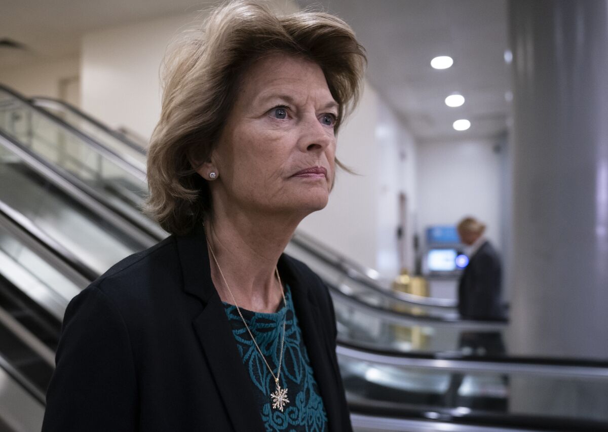FILE - In this Jan. 8, 2020, file photo Sen. Lisa Murkowski, R-Alaska, heads to a briefing on Capitol Hill in Washington. An Alaska man faces federal charges after authorities allege he threatened to hire an assassin to kill Murkowski, according to court documents unsealed Wed., Oct. 6, 2021. (AP Photo/J. Scott Applewhite,File)