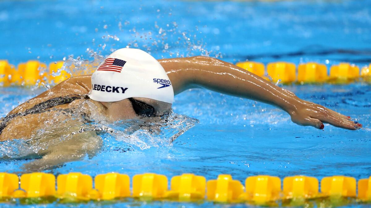 Katie Ledecky competes in a preliminary heat for the women's 400-meter freestyle on Sunday.