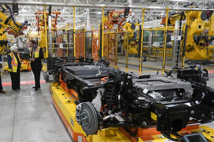 FILE - Treasury Secretary Janet L. Yellen tours the Ford Rouge Electric Vehicle Center before speaking about the Biden Administration's economic agenda in Dearborn, Mich., Sept. 8, 2022. Ford will drastically cut the number of hourly workers at the factory, which builds the Ford F-150 Lightning, as sales of electric vehicles slow. (AP Photo/Paul Sancya, File)