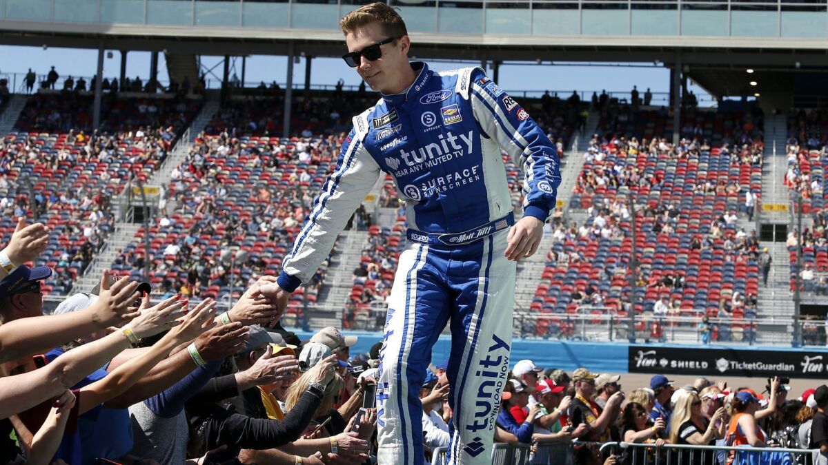 Matt Tifft is greeted by fans during driver introductions prior to the start of the NASCAR Cup Series race at ISM Raceway on Sunday in Avondale, Ariz.