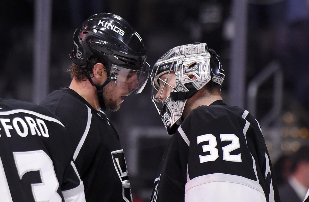 Anze Kopitar, left, and goalie Jonathan Quick congratulate each other after the Kings defeated Tampa Bay on Sunday.