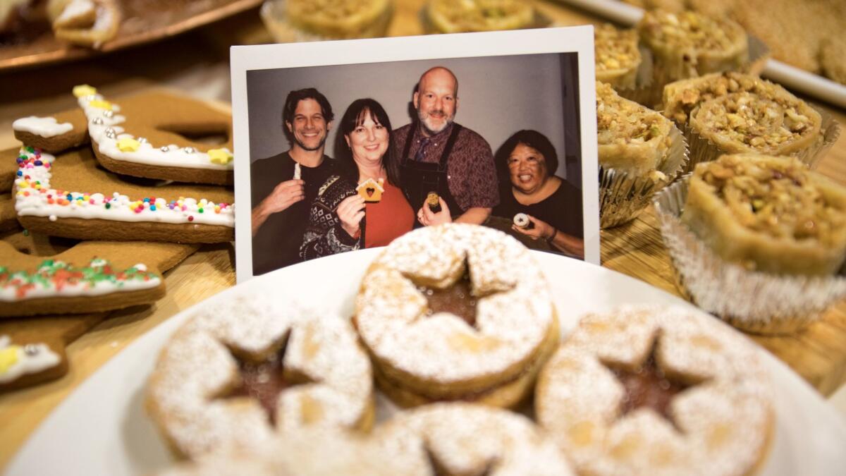 A photo of Dan Guerrera, Katie Rodgers, Scott Cronick and Alice Nishimoto among the cookies made using recipes they submitted for this year's Cookie Bake-Off.