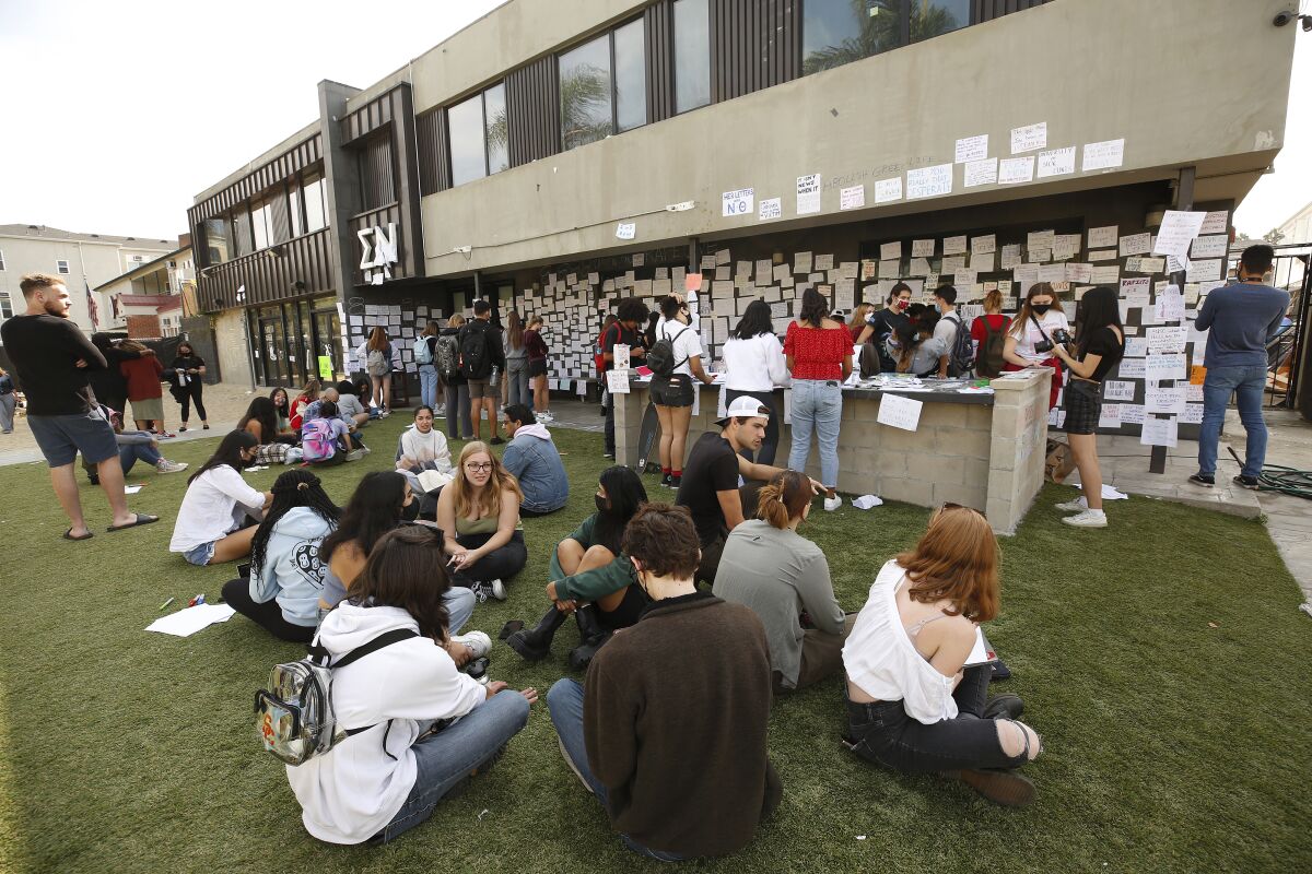 USC students gather Friday afternoon at the Sigma Nu fraternity house near the USC campus.