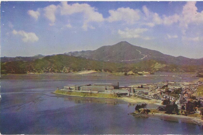 A view of San Quentin prison, on a point jutting into the bay, with Mount Tamalpais in the background