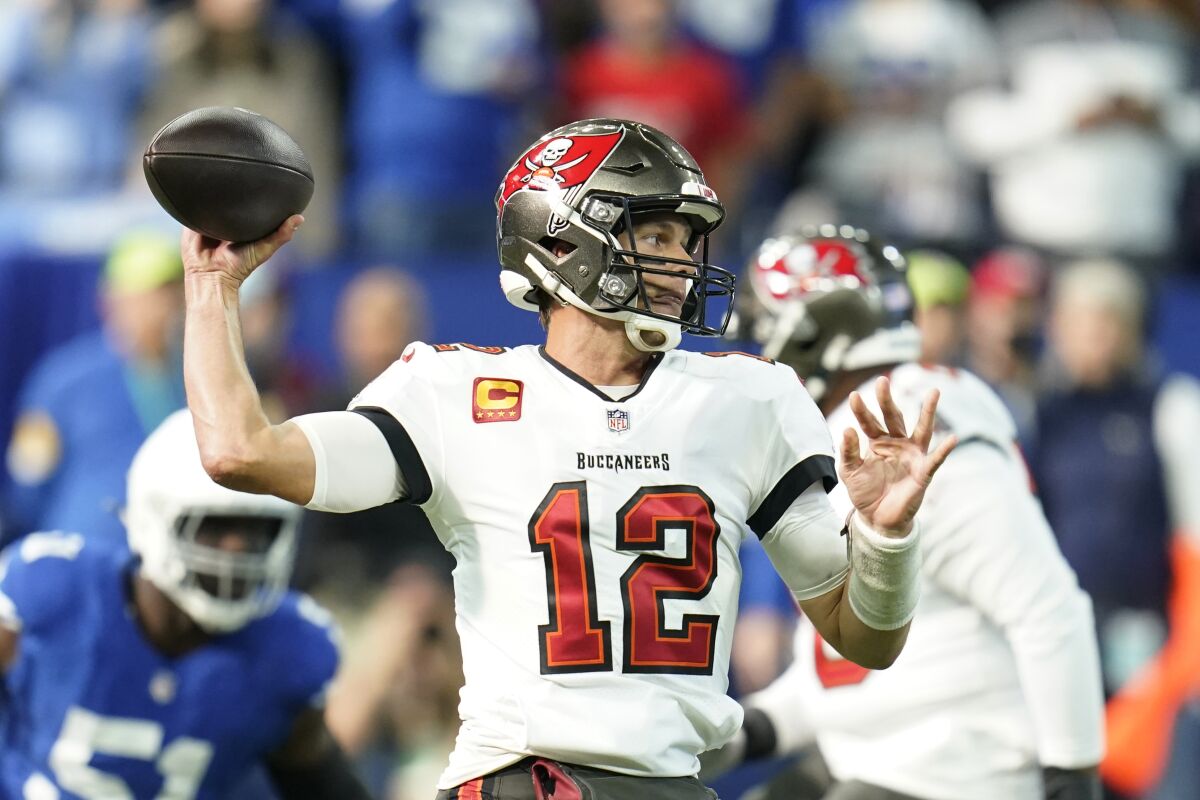 Tampa Bay Buccaneers quarterback Tom Brady looks to throw during the first half of an NFL football game against the Indianapolis Colts, Sunday, Nov. 28, 2021, in Indianapolis. (AP Photo/Michael Conroy)