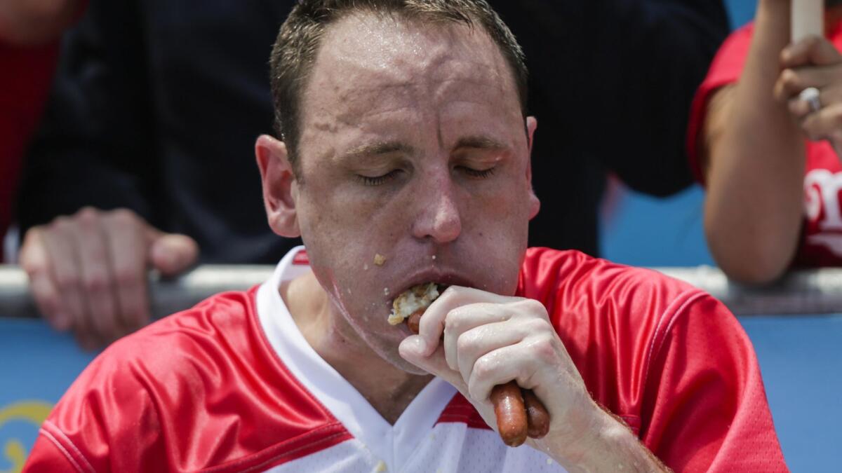 Joey Chestnut competes in the annual Nathan's Hot Dog Eating Contest on July 4, 2018, in the Coney Island neighborhood of the Brooklyn borough of New York City.