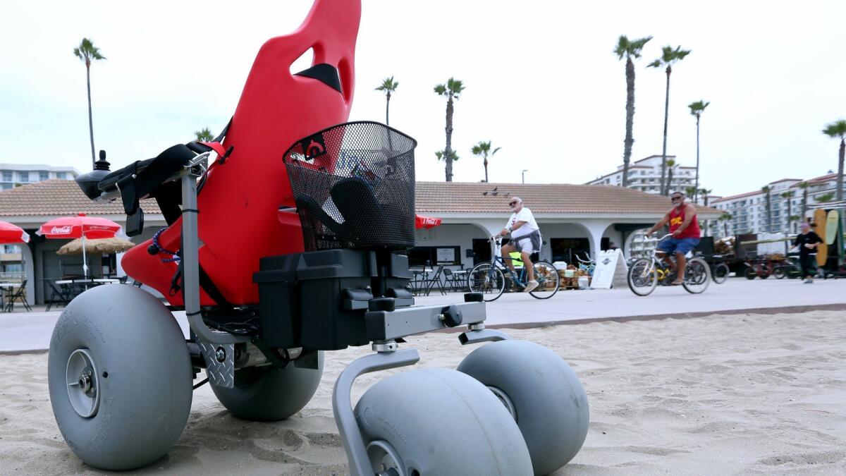 Bill Adamson, a retired Walt Disney Imagineer, created this large-wheeled motorized wheelchair for his granddaughter and now hopes Huntington Beach can provide them for people to use for free.