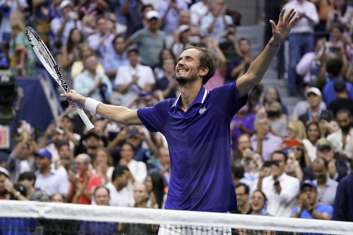 Daniil Medvedev reacts after defeating Novak Djokovic during the men's singles final