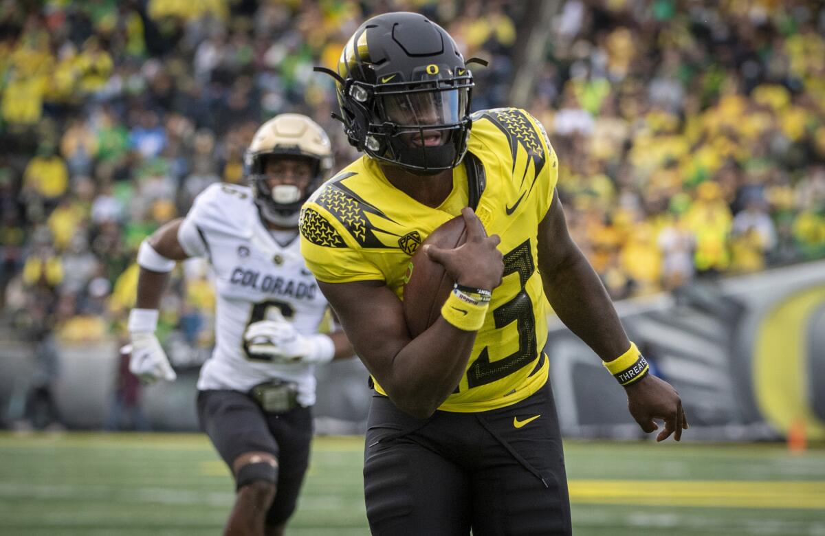 Oregon quarterback Anthony Brown runs the ball during the third quarter against Colorado.