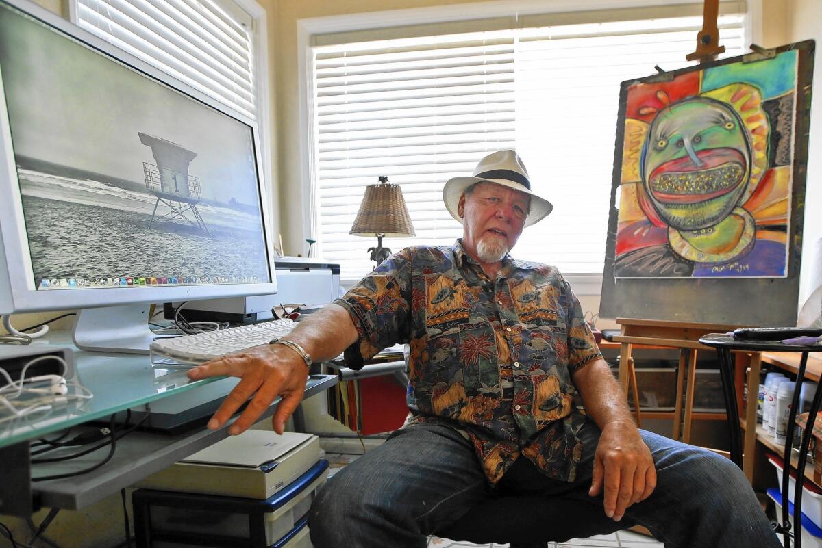 Michael Gross in his studio in Oceanside last year. Long before creating the 'Ghostbusters' film logo, he was art director at National Lampoon.