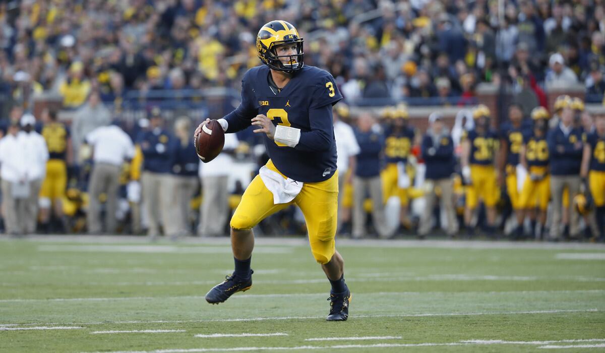Michigan quarterback Wilton Speight rolls out against Maryland Terrapins in the first half of a game on Nov. 5.
