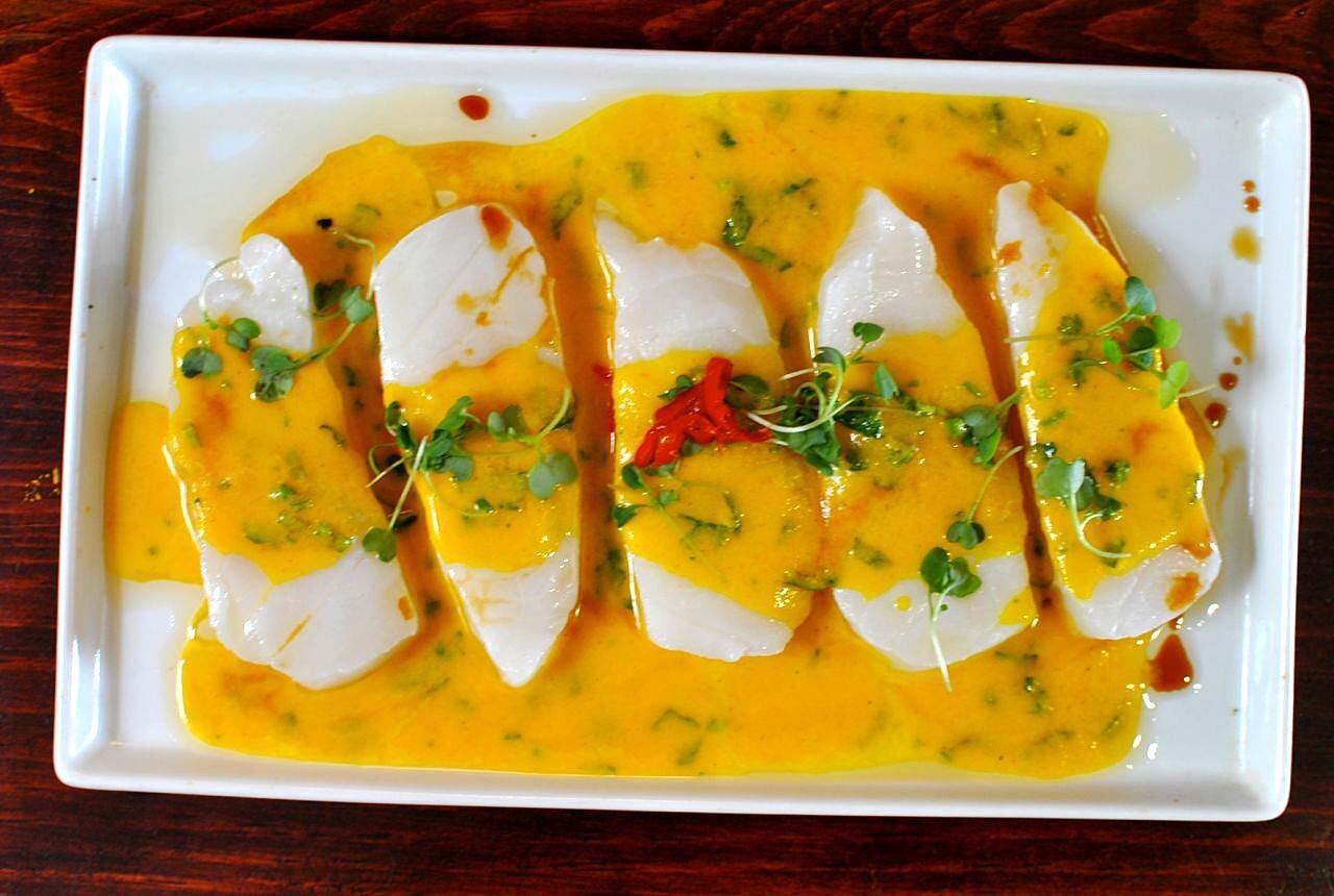 Tiradito de seabass: Seared cuts of seabass in a garlicky aji sauce.