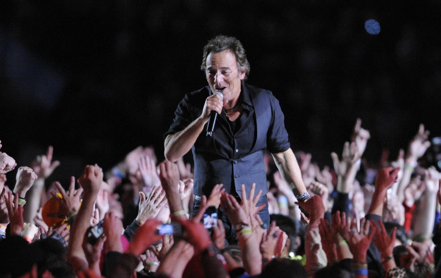 "Step back from the guacamole dip," Bruce Springsteen yelled through gritted teeth. "Put! The! Chicken! Fingers! Doooowwwwwwwn!" His show got the crowd riled up, but didn't quite score, as Springsteen hammed it up a bit too much for Super Bowl cameras.