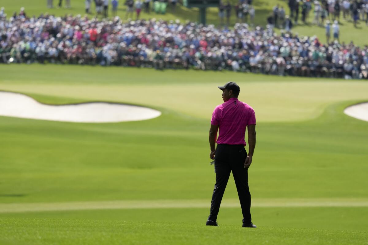 Tiger Woods waits to play on the second fairway during the first round at the Masters golf tournament in Augusta, Ga.