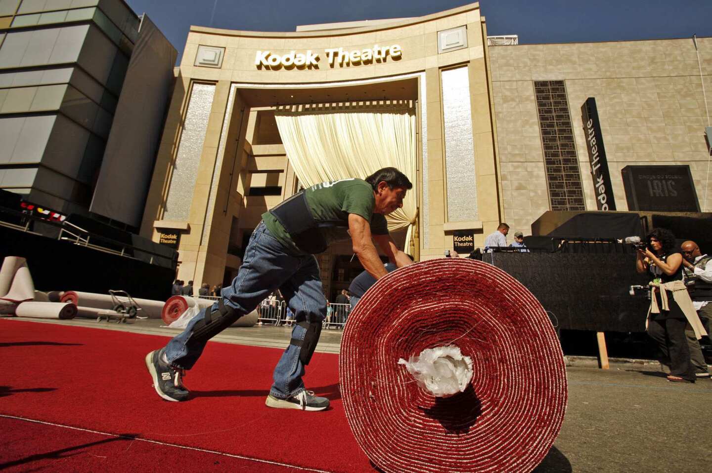Carlos Avila with American Turf and Carpet rolls out the iconic red carpet.