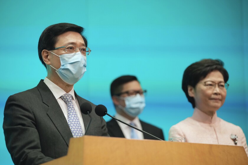 Three senior Hong Kong officials at news conference