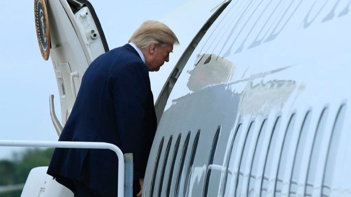 President Trump boards Air Force One at Andrews Air Force Base in Maryland on Saturday.