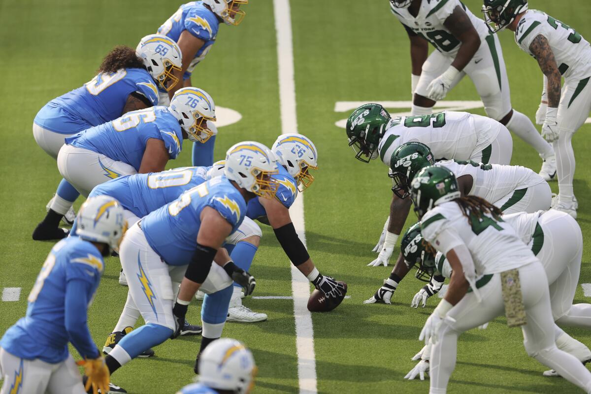 The Chargers offense lines up against the Jets' defensive front. 