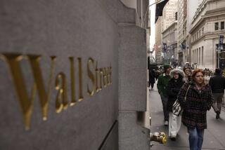 People walk past a Wall Street sign outside the New York Stock Exchange, Monday, Dec. 11, 2023, in New York. Wall Street is inching up modestly Wednesday ahead of a decision by the U.S. Federal Reserve on interest rates.(AP Photo/Yuki Iwamura)