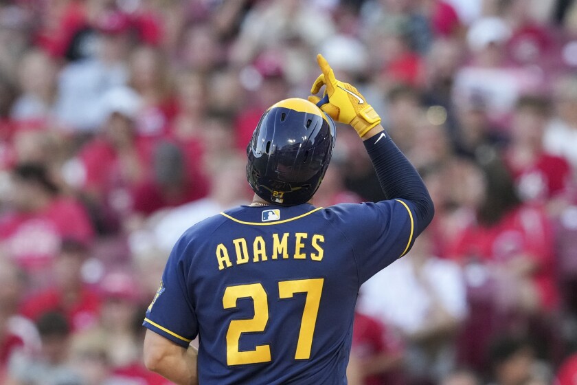 Brewers short stop Willy Adames points to the sky as he crosses home plate after a two-run home run vs the Reds