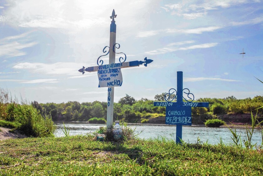 Crosses mark the spot where two children drowned in the Rio Grande near where Guillermo Arevalo Pedraza, 37, was shot and killed by a Border Patrol agent on Sept. 3, 2012. Witnesses said Arevalo was at a family barbecue.