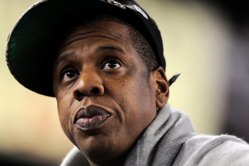 Mandatory Credit: Photo by JUSTIN LANE/EPA-EFE/REX (10267537a) (FILE) - Music mogul Jay-Z watches game five of the American League Division Series playoffs between the New York Yankees and the Detroit Tigers at Yankees Stadium in the Bronx, New York, USA, 06 October 2011 (reissued 04 June 2019). According to media reports, Jay-Z has accumulated a fortune that surpassed 1 billion US dollar, becoming the first hip-hop artist to do so. His assets include real estate, investments in art, and stakes in liquor, fashion and music streaming companies. Jay-Z declared first hip-hop billionaire by Forbes, Bronx, USA - 06 Oct 2011 ** Usable by LA, CT and MoD ONLY **