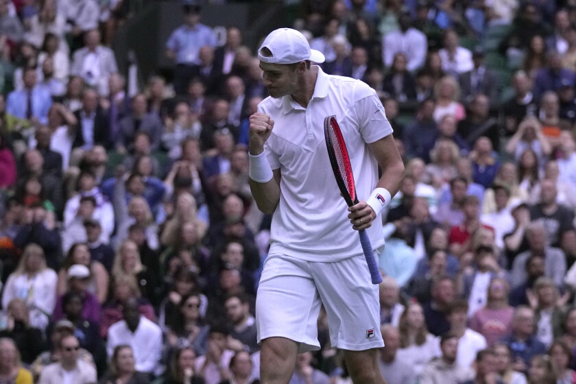 John Isner pumping his fist.