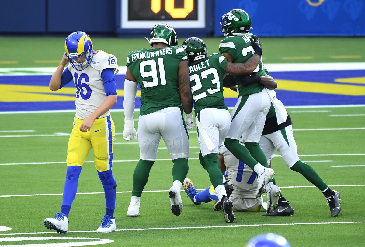 Rams quarterback Jared Goff walks off the field after having a pass intercepted against the Jets.